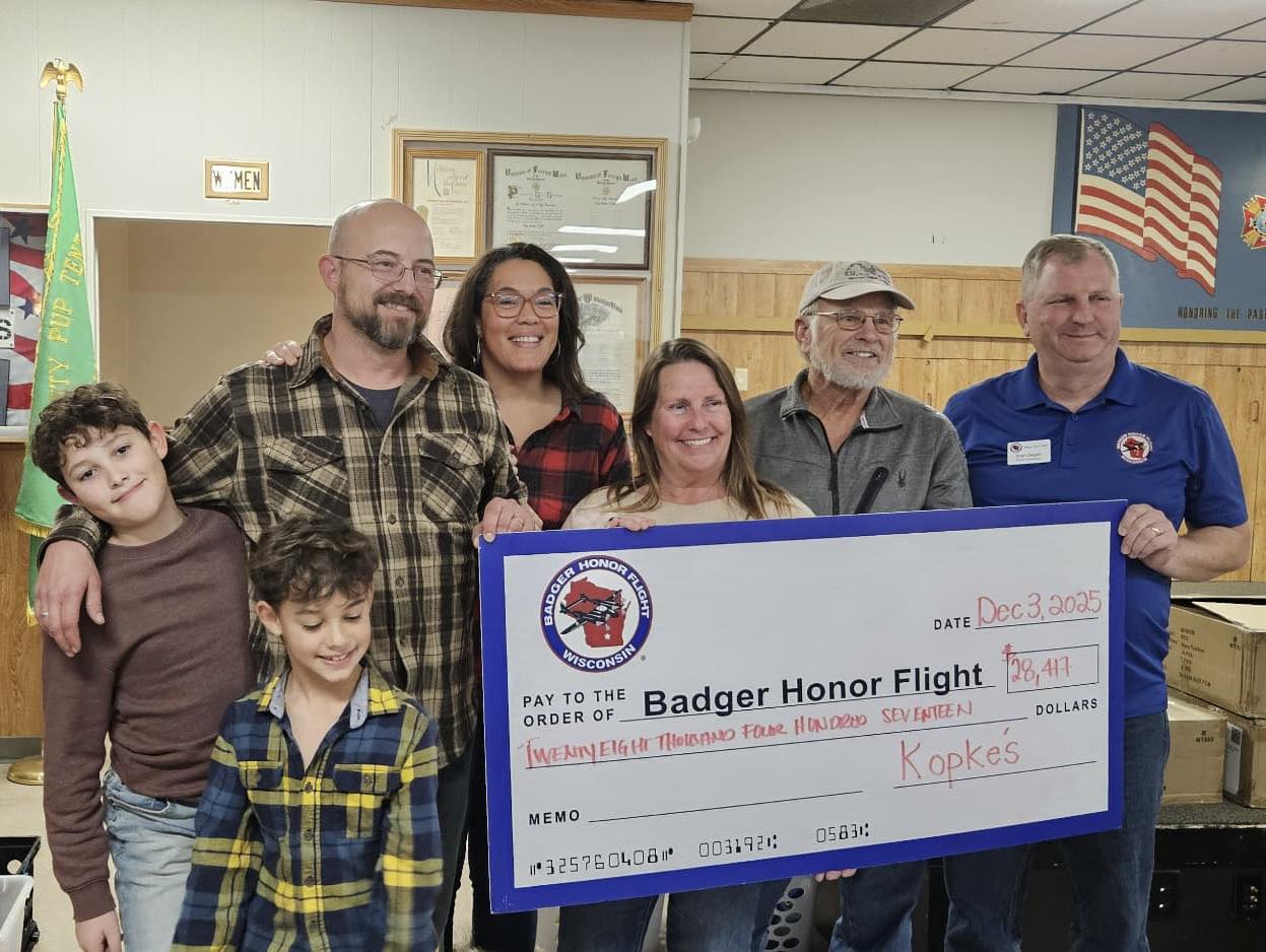 Members of Kopke's Greenhouse presenting the fundraising check to Badger Honor Flight in 2025